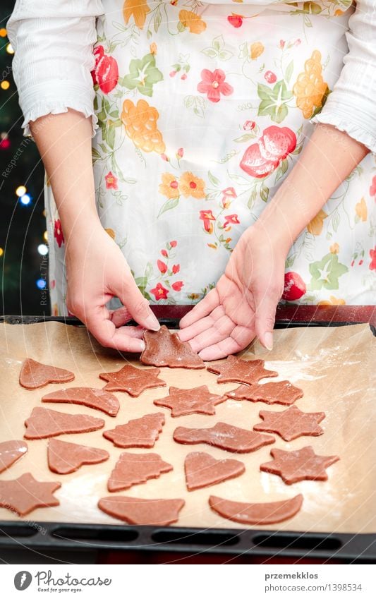 Cutting out the Christmas symbols in the dough for the cookies Table Kitchen Human being Woman Adults Hand 1 30 - 45 years Make Flour Gingerbread Home-made