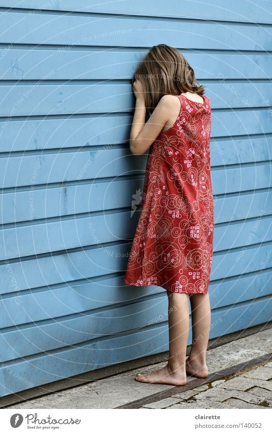 Don't turn around. Colour photo Multicoloured Exterior shot Day Full-length Looking away Playing Summer Child Girl Dress Cry Red Emotions Sadness Loneliness