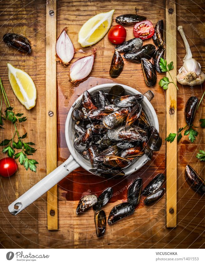 Fresh mussels in an old sieve with ingredients Food Seafood Herbs and spices Nutrition Lunch Dinner Buffet Brunch Banquet Organic produce Vegetarian diet Diet