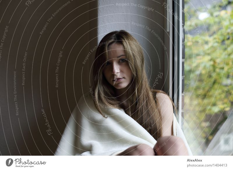 behind the window Well-being Relaxation Young woman Youth (Young adults) 18 - 30 years Adults Window Blanket Brunette Long-haired Sit Esthetic Authentic