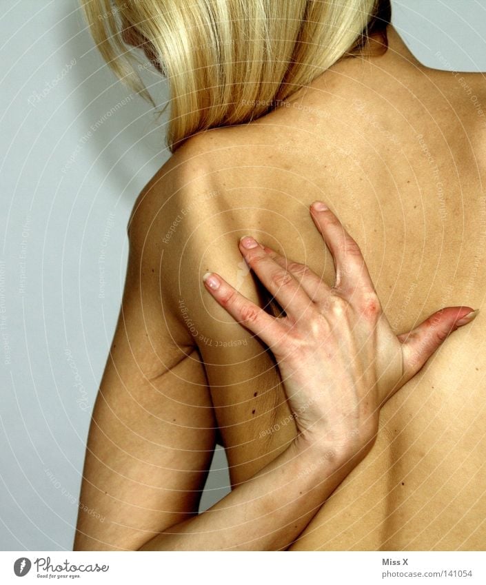 backaches Skin Woman Adults Back Arm Hand Blonde Naked Pain Shoulder Massage Wellness Colour photo Interior shot Nude photography Upper body Rear view
