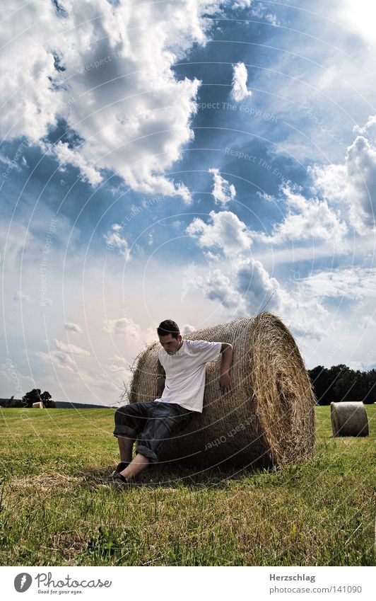 Summer Battle Desire Field Hay Bale of straw Hay bale Ball of the foot Meadow Power Force Pressure Stay Fear Roll Round Clouds White T-shirt Shirt Pants