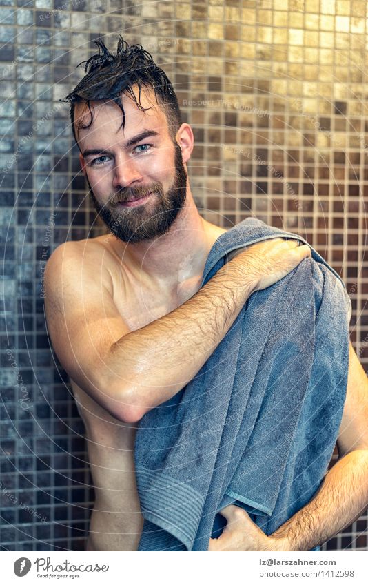 Handsome young man drying himself Body Skin Face Wellness Bathroom Masculine Man Adults 1 Human being Beard Smiling Wet Clean Soft Gray attractive bath care