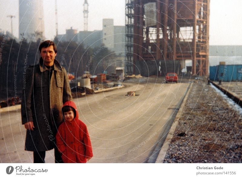 On the construction site Coal power station The Ruhr Seventies Father Workplace Planning Day Working shoes Production line Son Child Red Brown Street