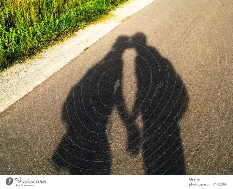kiss Love Kissing Safety (feeling of) Shadow Street Couple Man Woman In pairs Lovers Together Relationship Trust Affection Harmonious Happy Related Infatuation