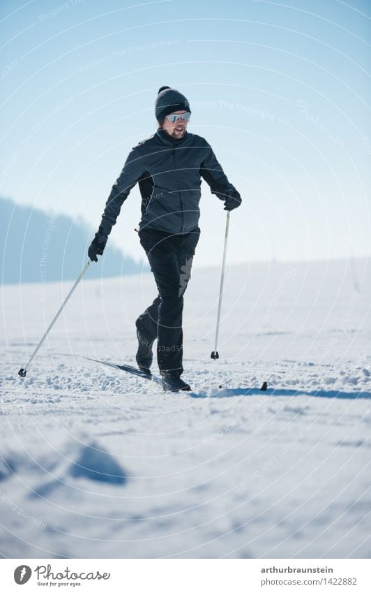 Young man cross-country skiing Athletic Fitness Leisure and hobbies Cross-country skier Trip Winter Snow Winter vacation Sports Sports Training Winter sports