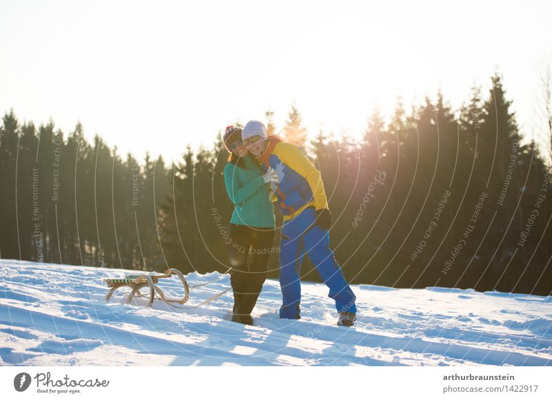 Young couple in winter Lifestyle Joy Athletic Leisure and hobbies Sleigh Vacation & Travel Tourism Trip Winter Snow Winter vacation Hiking Winter sports