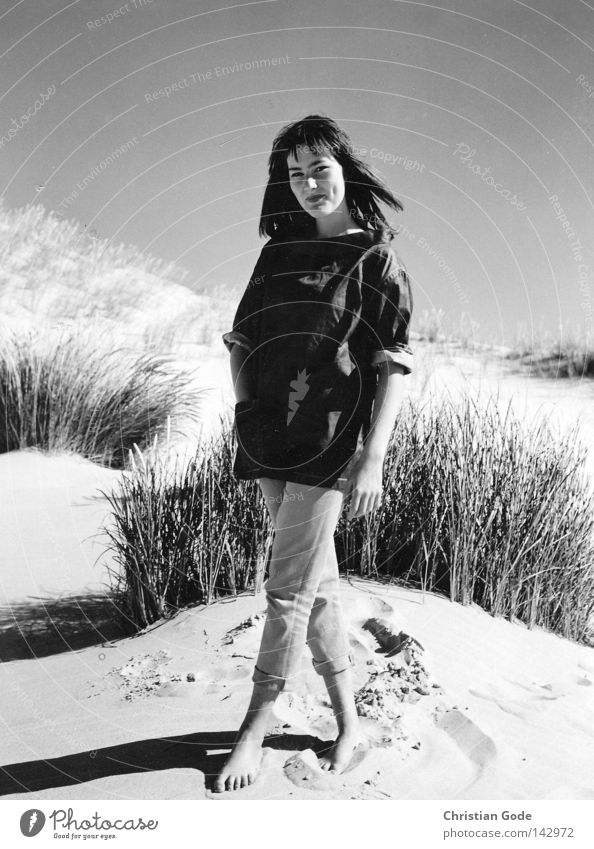 dune lady Beach Black & white photo Woman Lady Youth (Young adults) Beautiful Posture Vacation & Travel Sun Relaxation Beach dune Dune Ocean Grass Plant Jacket