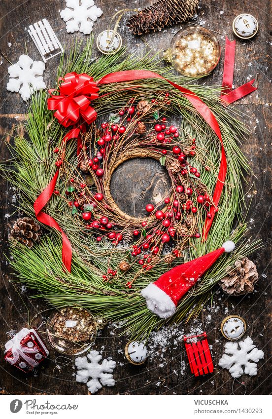 Christmas wreath with berries, ribbon and Christmas decorations Style Design Winter Flat (apartment) Interior design Decoration Event Feasts & Celebrations