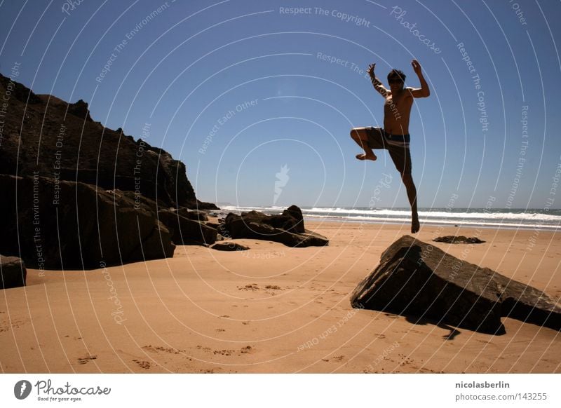 the Gap between Thinking and Feeling Beach Ocean Man Black Relaxation Posture Action Statue Portugal Alentejo Jump Success seaside Sand Sky boy Rock Stone Blue