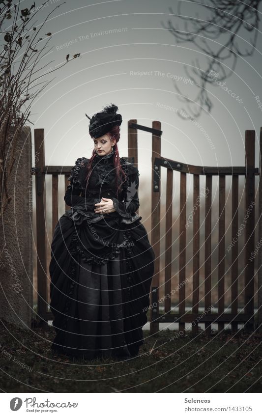 The door Human being Feminine Woman Adults 1 Autumn Winter Tree Fashion Clothing Dress Hat Black Sadness Concern Grief Death Pain Loneliness Gate Baroque