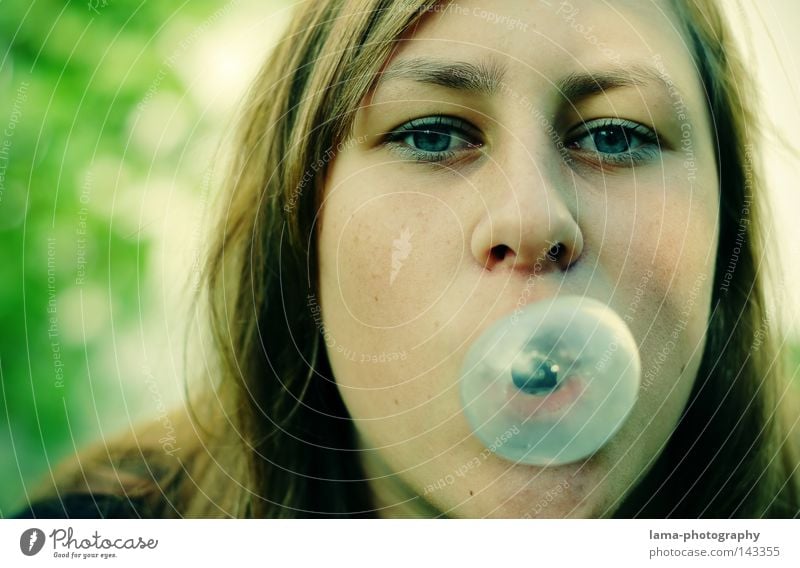 bubbly Woman Youth (Young adults) Puberty Chewing gum Chewing gum bubble Air bubble Soap bubble Portrait photograph Blue Looking Ease Flexible Joy young adults