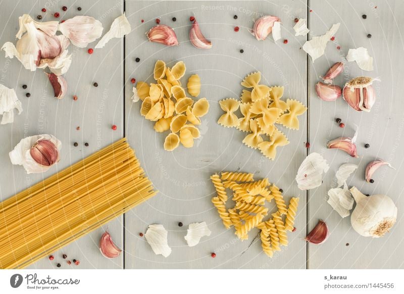 pasta Food Noodles Nutrition Lunch Dinner Yellow Gray To enjoy Farfalle Garlic Clove of garlic Eating Pepper Spaghetti Herbs and spices Cooking Colour photo