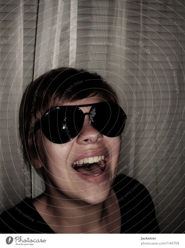 The last one to laugh... Drape Venetian blinds Woman Young lady Cheek Chin Emotions sunglasses Laughter Hair and hairstyles Neck Tongue Teeth