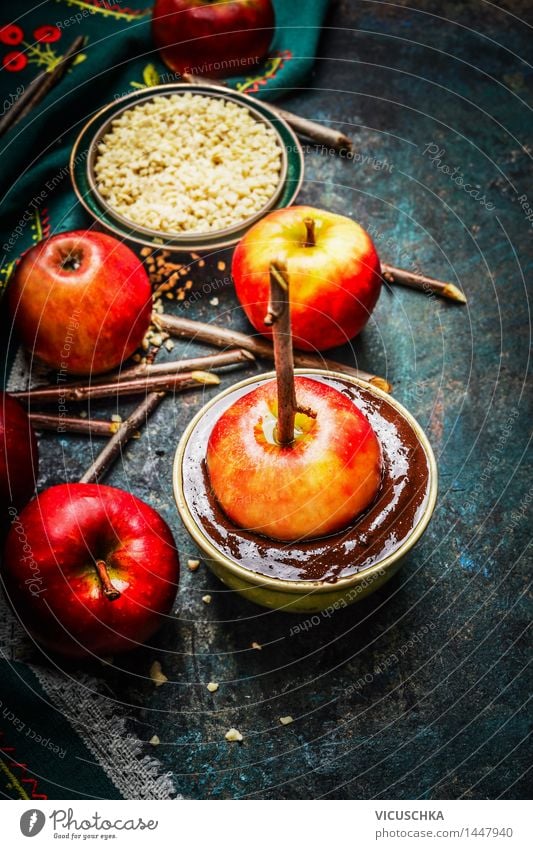 Apples on sticks with melting chocolate Food Fruit Dessert Candy Chocolate Nutrition Banquet Organic produce Vegetarian diet Bowl Style Design Joy Life Table