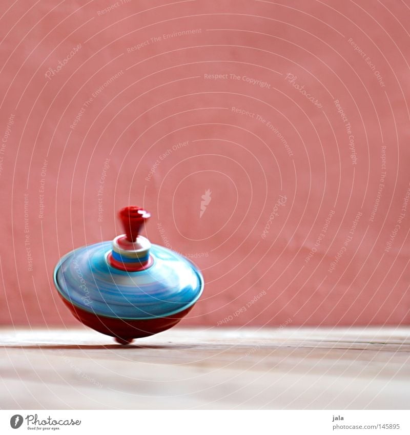 colors in motion Leisure and hobbies Playing Dance Toys Kitsch Odds and ends Movement Rotate Speed Pink Red Colour Rotation Gyroscope Colour photo Exterior shot