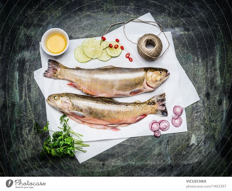 Raw fish on white paper with ingredients for cooking Food Fish Herbs and spices Cooking oil Nutrition Lunch Dinner Banquet Organic produce Vegetarian diet Diet