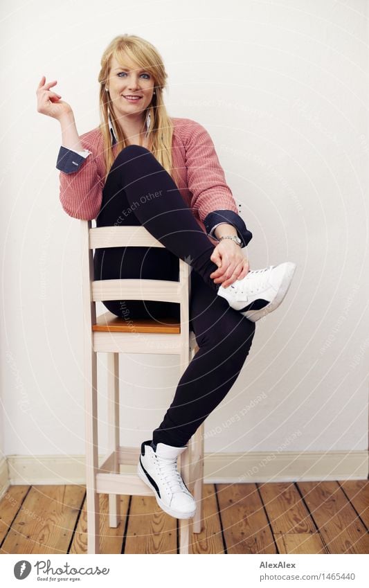 interview Style Beautiful Athletic Well-being Contentment Room Floorboards Young woman Youth (Young adults) Body 18 - 30 years Adults Leggings Sweater Sneakers