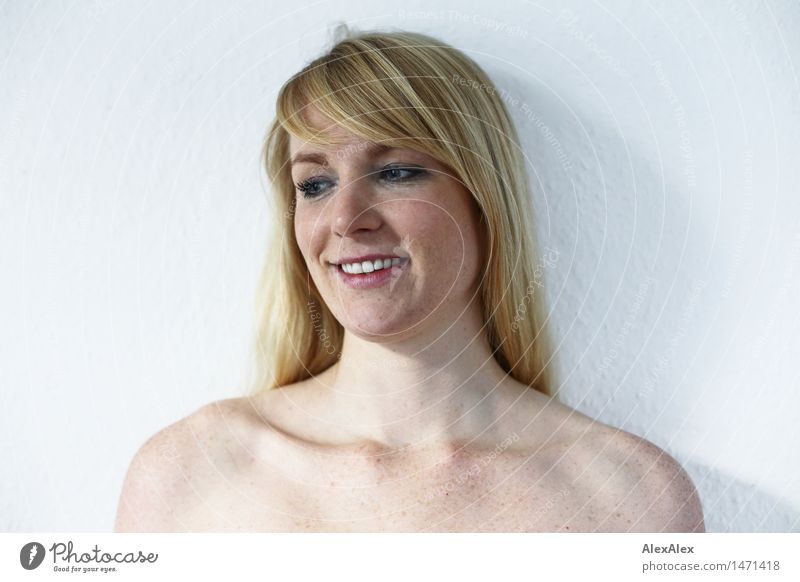 Portrait of a young freckled woman in front of a white wall pretty Harmonious Contentment Young woman Youth (Young adults) Face Collarbone 18 - 30 years Adults