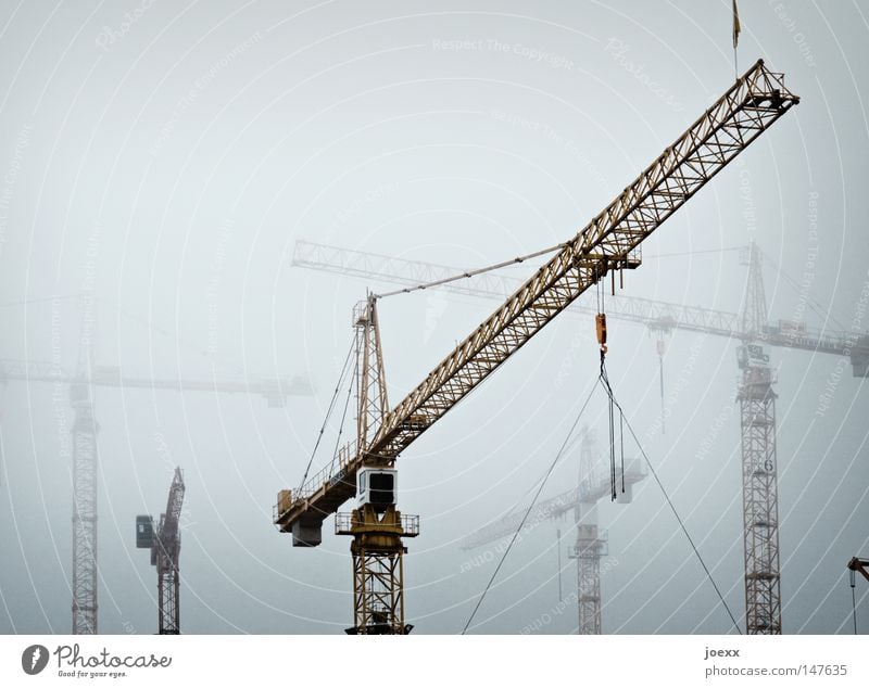 fog skeletons Construction Arrange Build Construction site Produce Dangerous Gray Craft (trade) Industry Cold Crane Fog Bad weather Sky Threat