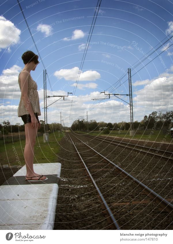 left Railroad Woman Railroad tracks Future Direction Sky Clouds Stand Loneliness Australia Desire Train station Vacation & Travel Wait Lanes & trails Blue Hope