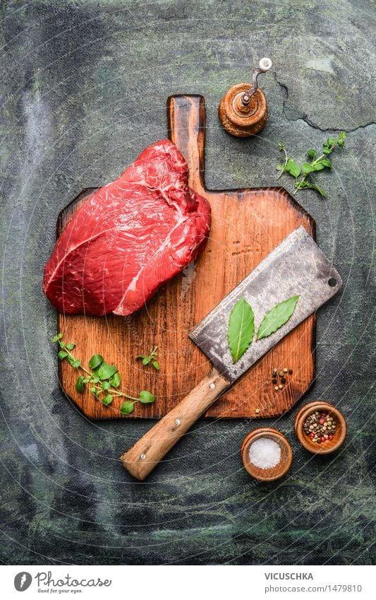 piece of beef on cutting board with butcher's hatchet Food Meat Herbs and spices Nutrition Lunch Dinner Banquet Organic produce Knives Healthy Eating Table