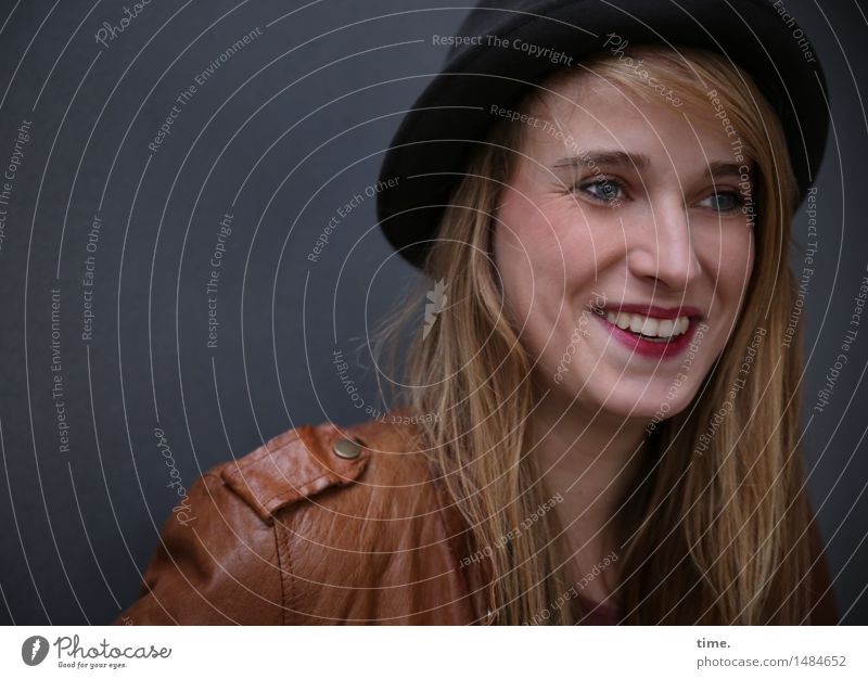 . Feminine Woman Adults 1 Human being Jacket Leather jacket Hat Blonde Long-haired Observe Smiling Laughter Looking Wait Happiness Beautiful Joy Happy