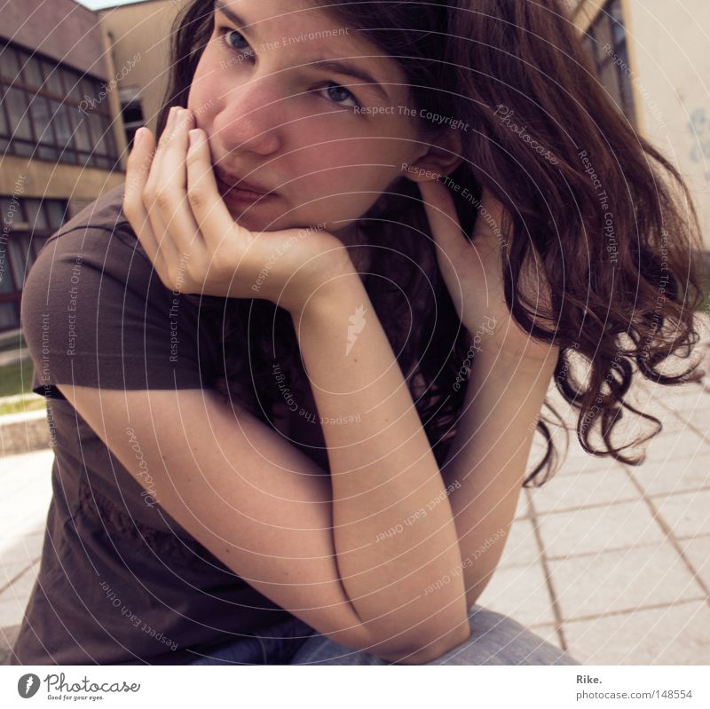 Dreaming. Brown Hair and hairstyles Youth (Young adults) Woman Portrait photograph Curl Beautiful Think Close-up T-shirt Grief Feminine Doubt Skeptical Distress