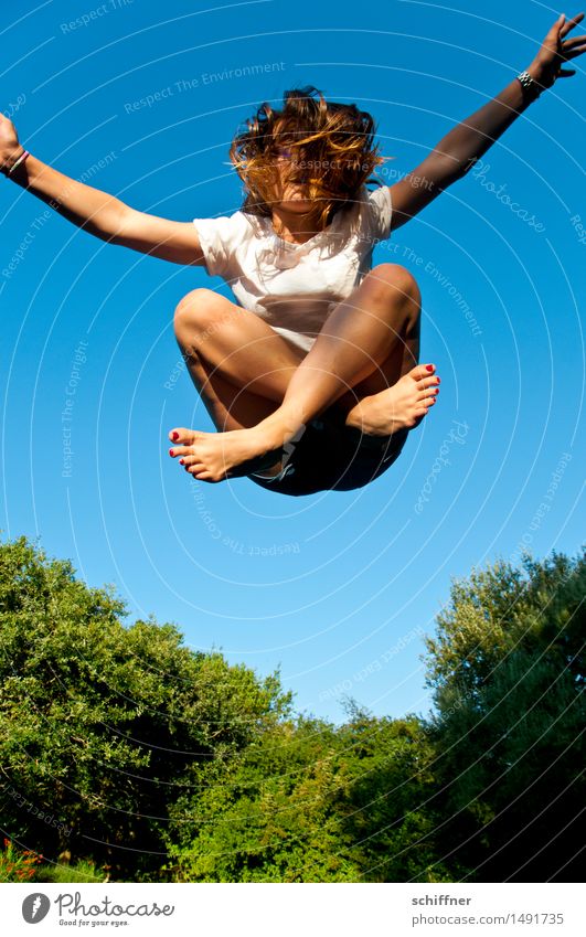 Child jumping trampoline - figure cross-legged seat Leisure and hobbies Playing Human being Feminine Girl Young woman Youth (Young adults) Hand Fingers Feet 1