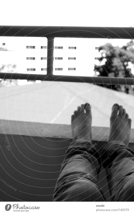 balcony views Black & white photo Contentment Relaxation Legs Feet Wall (barrier) Wall (building) Balcony Dangerous Perspective Put one's feet up Handrail