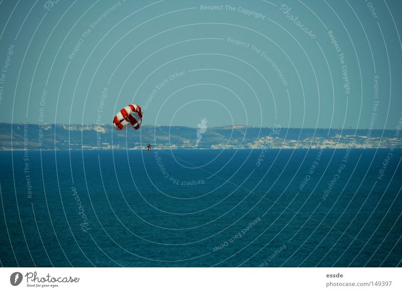 para Colour photo Exterior shot Copy Space top Copy Space bottom Joy Playing Vacation & Travel Ocean Sports Human being Tall Blue Red White Paragliding