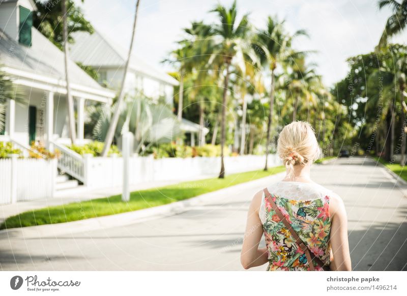 USA, Florida, Key West, woman / tourist in dress on sidewalk blonde hair Exterior shot Dress vacation Vacation mood palms Caribbean Tropical Lanes & trails