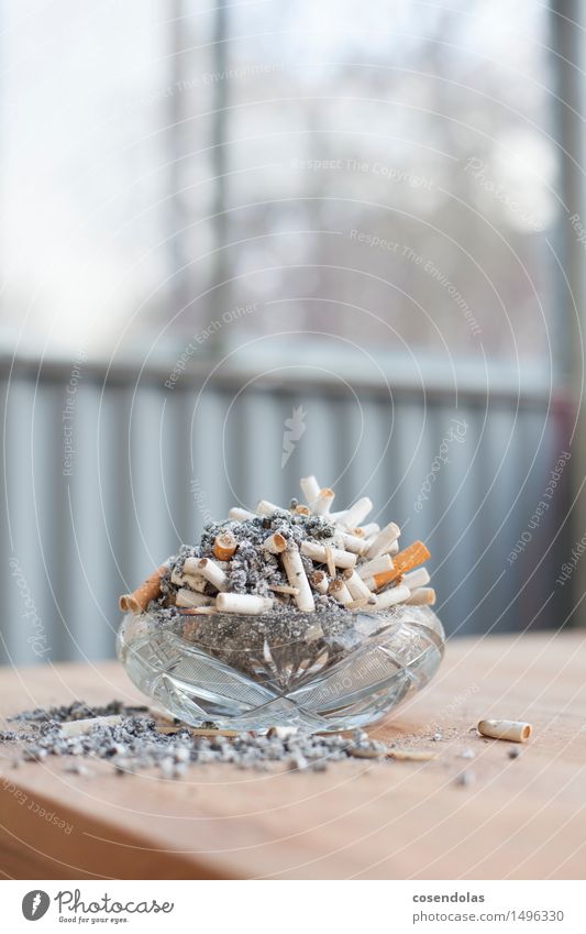 installation Illness Smoking Ashtray Cigarette Ashes Table Colour photo Subdued colour Copy Space top Central perspective