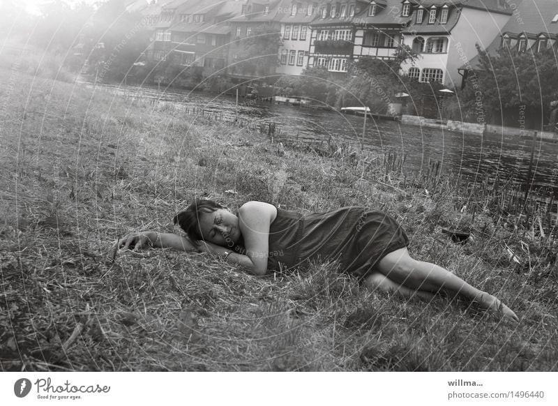 Woman sleeping in grass on the bank of river Lie Rest River bank Summer Meadow Regnitz river Bamberg Dress Relaxation Sleep Restful Fatigue Vacation mood