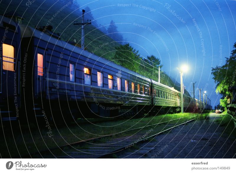 NightTrain Nostalgia Russia Railroad Means of transport Railroad car Railroad tracks Lantern Train window Lighting Evening Blue Mystic Clouds Calm
