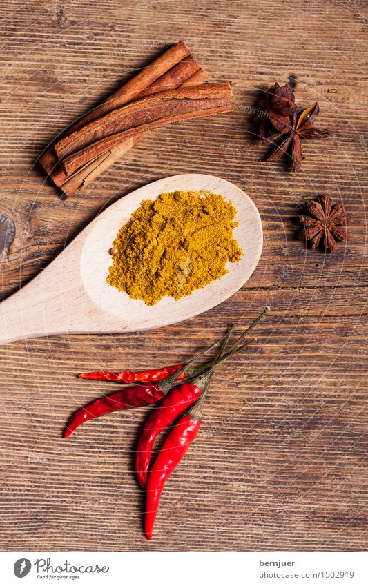 curry Food Herbs and spices Nutrition Asian Food Exotic Good Brown Yellow Red Curry powder Cinnamon cinnamon stick Chili Star aniseed pissed Wooden spoon Rustic