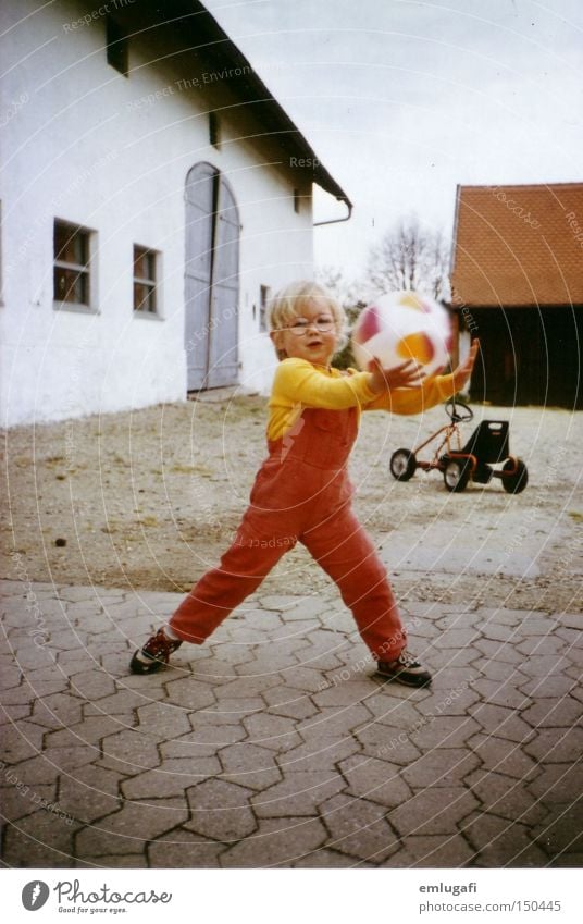 ball game Retro Ball Ball sports Child Infancy Birthday Farm Courtyard Eyeglasses Red Legs apart Action Joy Toddler