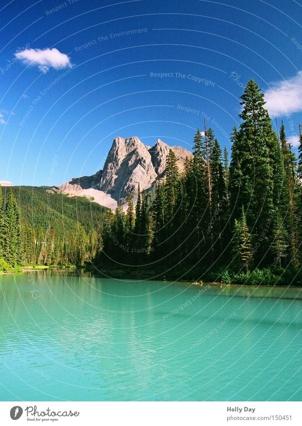 Lake Emerald Colour photo Multicoloured Exterior shot Deserted Day Shadow Reflection Long shot Mountain Sky Clouds Tree Blue Green Canada Turquoise