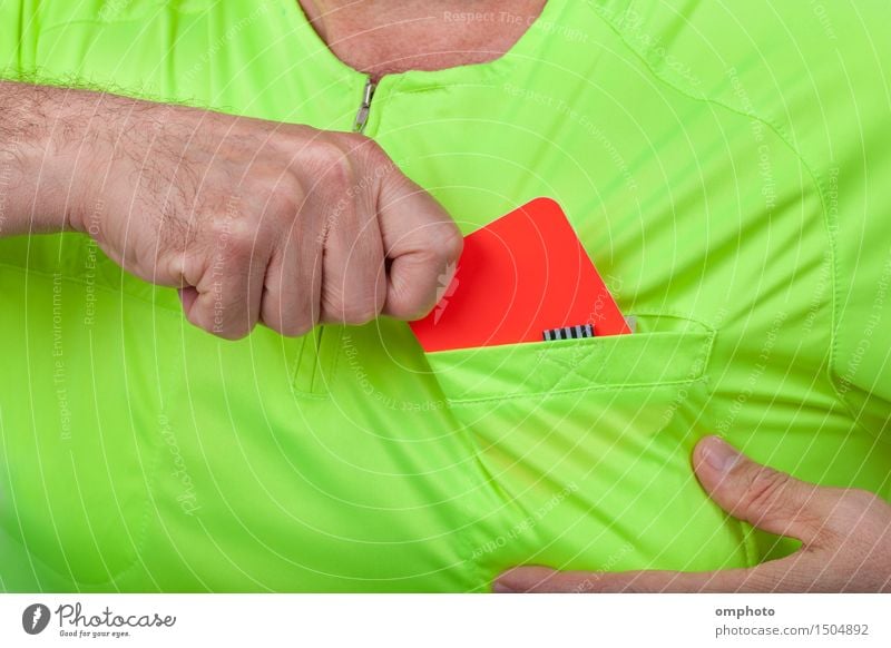 Referee takes out a red card from his pocket Sports Soccer Human being Man Adults Hand Shirt Yellow Green Red card sign punishment football penalty official