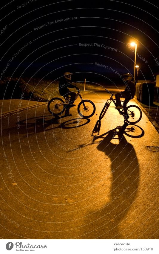 Nightrider ll Motorcyclist Bicycle Sports Helmet Man Twilight Shadow Stand Sit Tire Lantern Success Joy Extreme sports downhill freeride