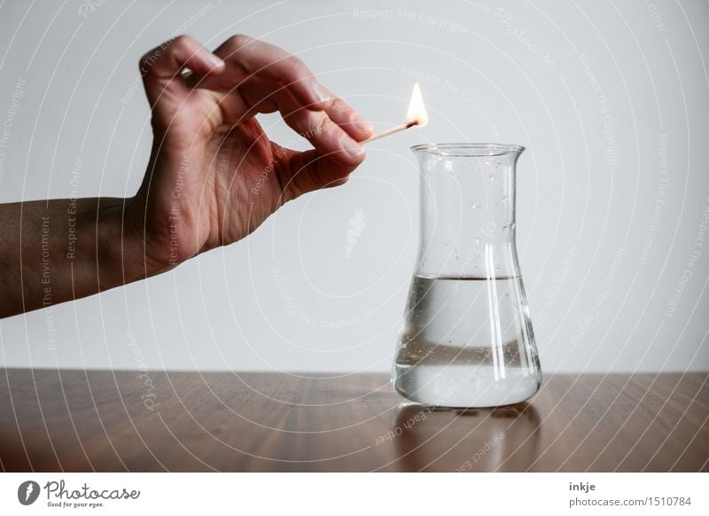 Does it burn? | Experiment Science & Research Experimental Chemistry Hand Match Fuel Erlenmeyer flask Fluid Test tube Glass Threat Curiosity Interest Dangerous