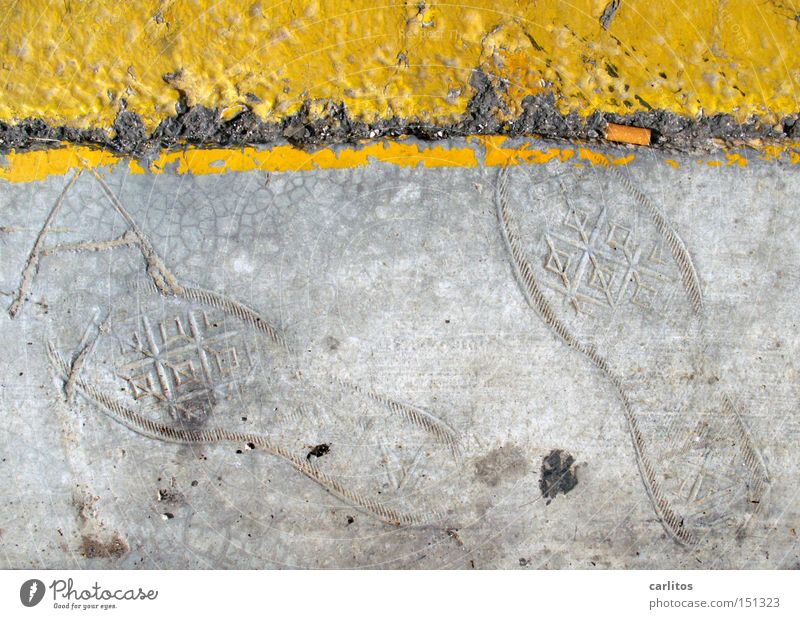 Fossils of the day after tomorrow Concrete Gray Yellow Line Footprint Tracks Archeology Rubber boots Street Roadside Clearway Street sign Obscure Cigarette Butt