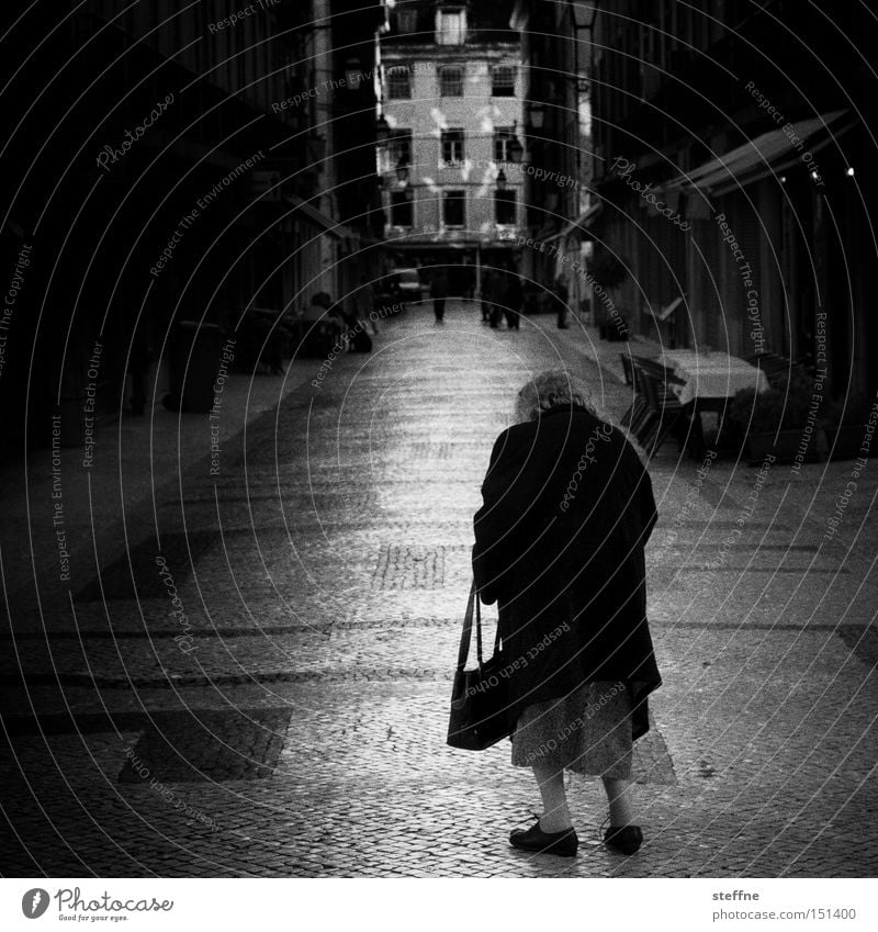 late Street To go for a walk Woman Senior citizen Old Handbag Loneliness Extinct Old town Black & white photo Female senior 50+