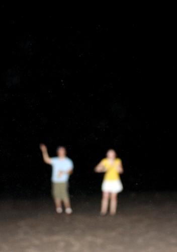 Beach at night Lifestyle Joy Freedom Summer Human being Young woman Youth (Young adults) Young man 2 Sand Night sky Stand Far-off places Happiness Modern