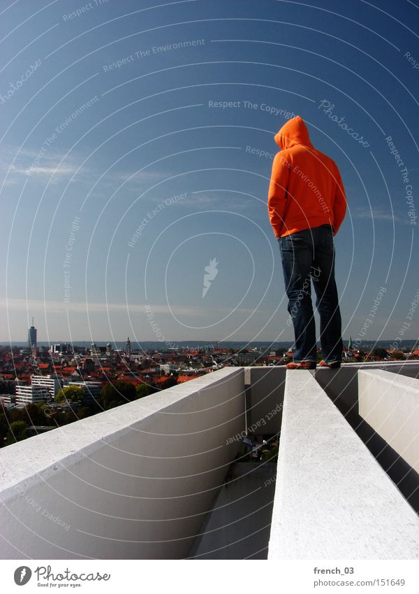 stands perfectly there Hooded (clothing) Human being Sky Stand Horizon Freedom Might Think Clarity Orange Concrete Future Tall Roof Building