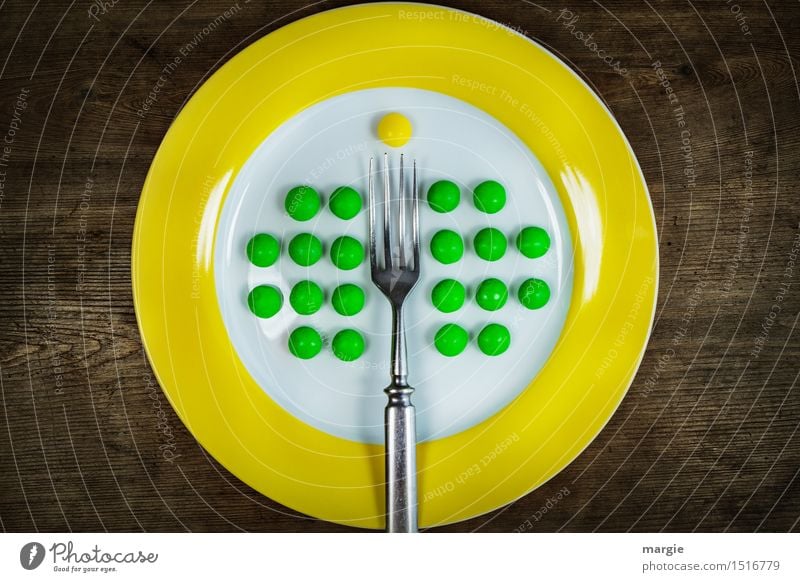 To the point! Impaled! A plate with a yellow rim and green peas well arranged, a fork and a yellow pill Food Dessert Nutrition Breakfast Lunch Dinner Buffet