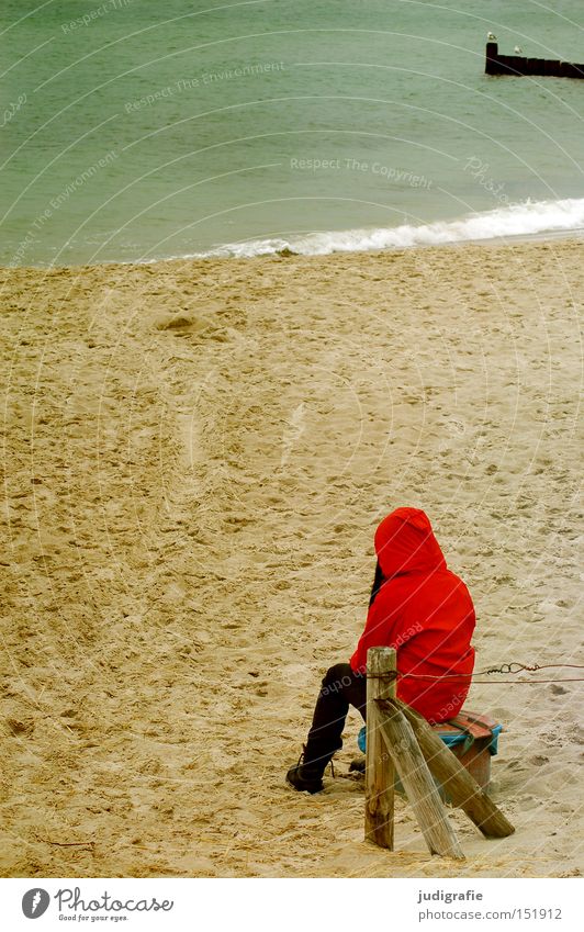 Red on the beach Beach Girl Human being Woman Rain jacket Autumn Sand Coast Ocean Vacation & Travel Cold Loneliness Think Colour