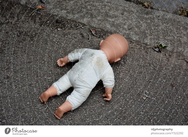 Baby doll face down in the street Toys Doll Bizarre Street Photography Stock fake Colour photo Exterior shot Deserted Morning Dawn Day Full-length Rear view