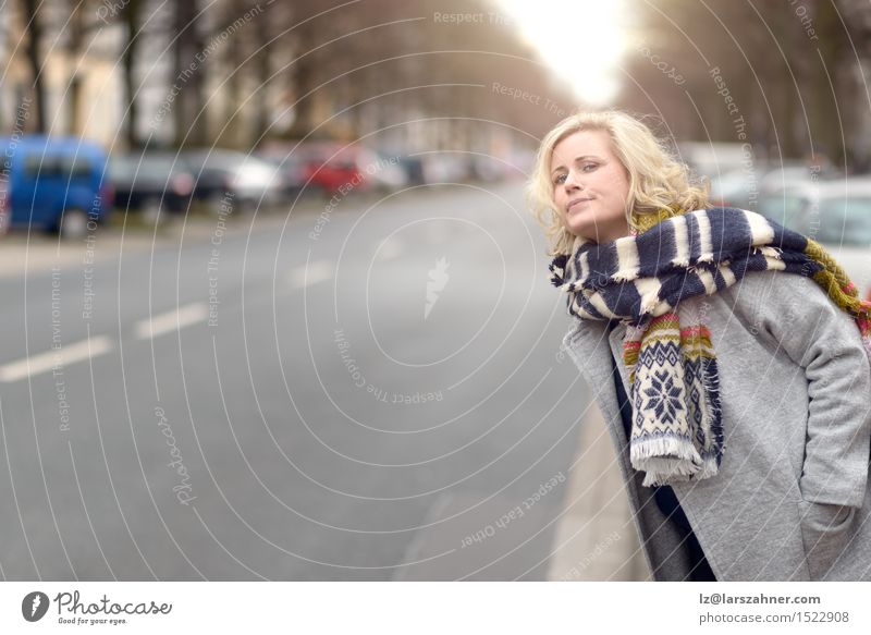 Blond woman waiting for a cab or a bus Winter Woman Adults 1 Human being 30 - 45 years Street Fashion Scarf Blonde Wait Alley anxiously Motor vehicle