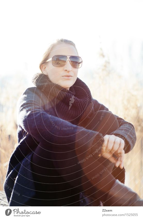 sun seat Feminine Young woman Youth (Young adults) 1 Human being 18 - 30 years Adults Nature Common Reed Lakeside Coat Sunglasses Scarf Observe Relaxation Sit